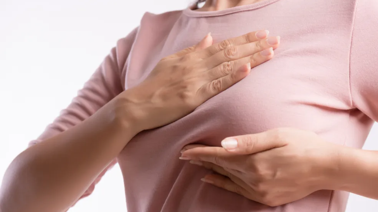 woman-hand-checking-lumps-her-breast-signs-breast-cancer-1-